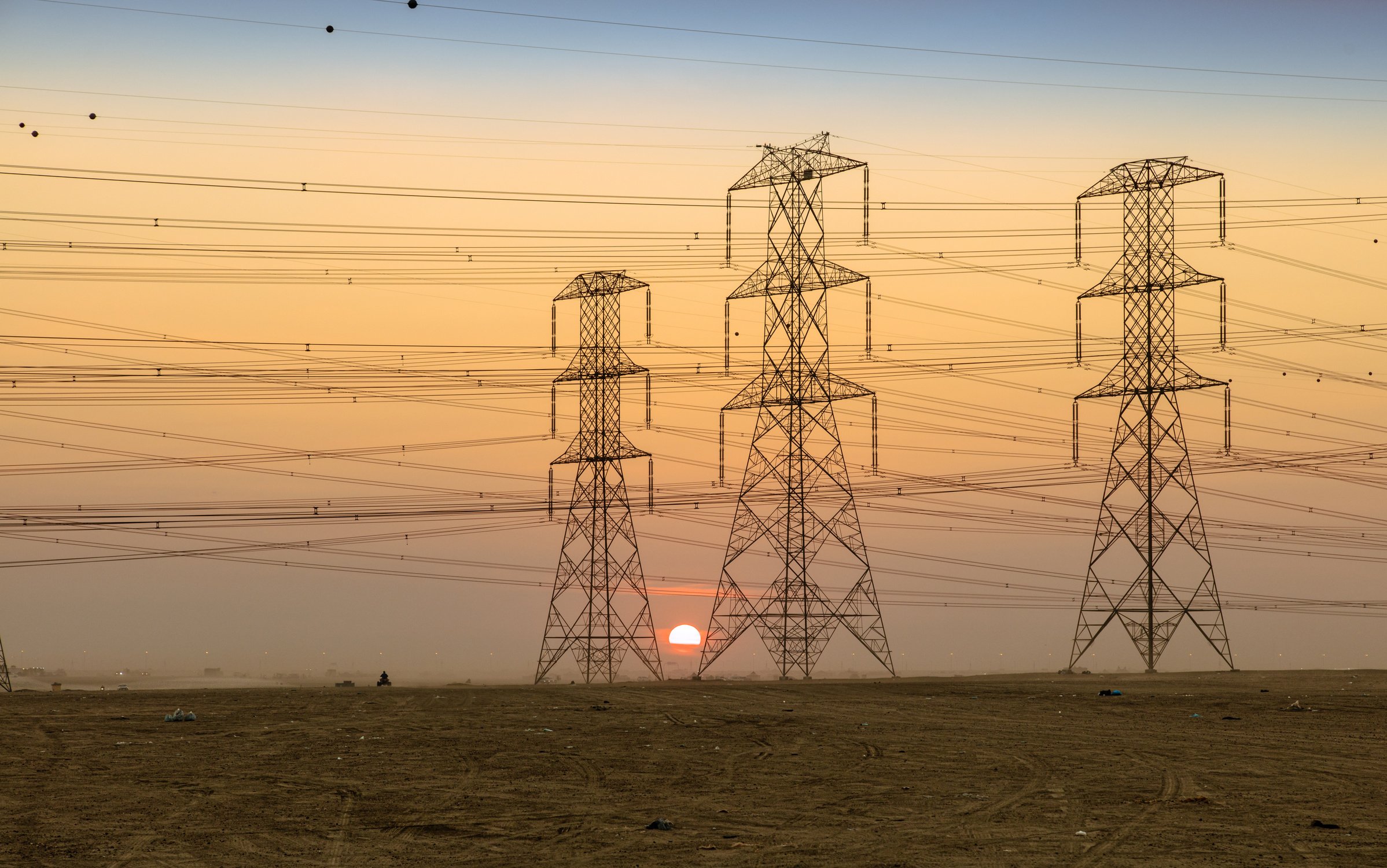 Silhouette of Electric Towers During Sunset